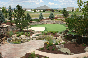 This is a water free landscape with artificial turf and a synthetic golf putting green