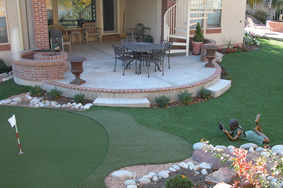 Backyard with artificial turf anf golf putting green